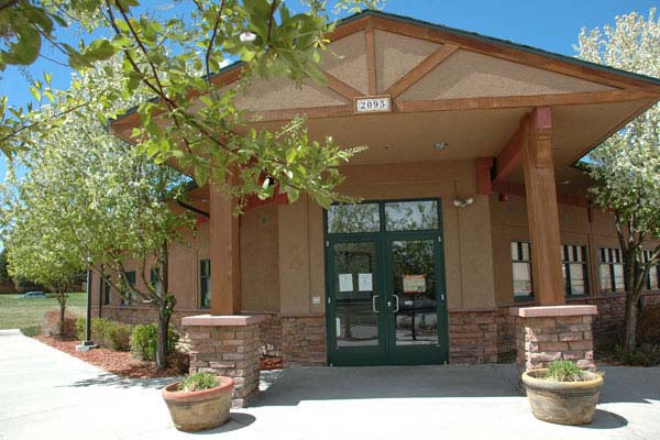 Entry to Kipling Veterinary Animal Hospital where an inviting waiting room with comfortable seating and a friendly receptionist welcomes pet owners.